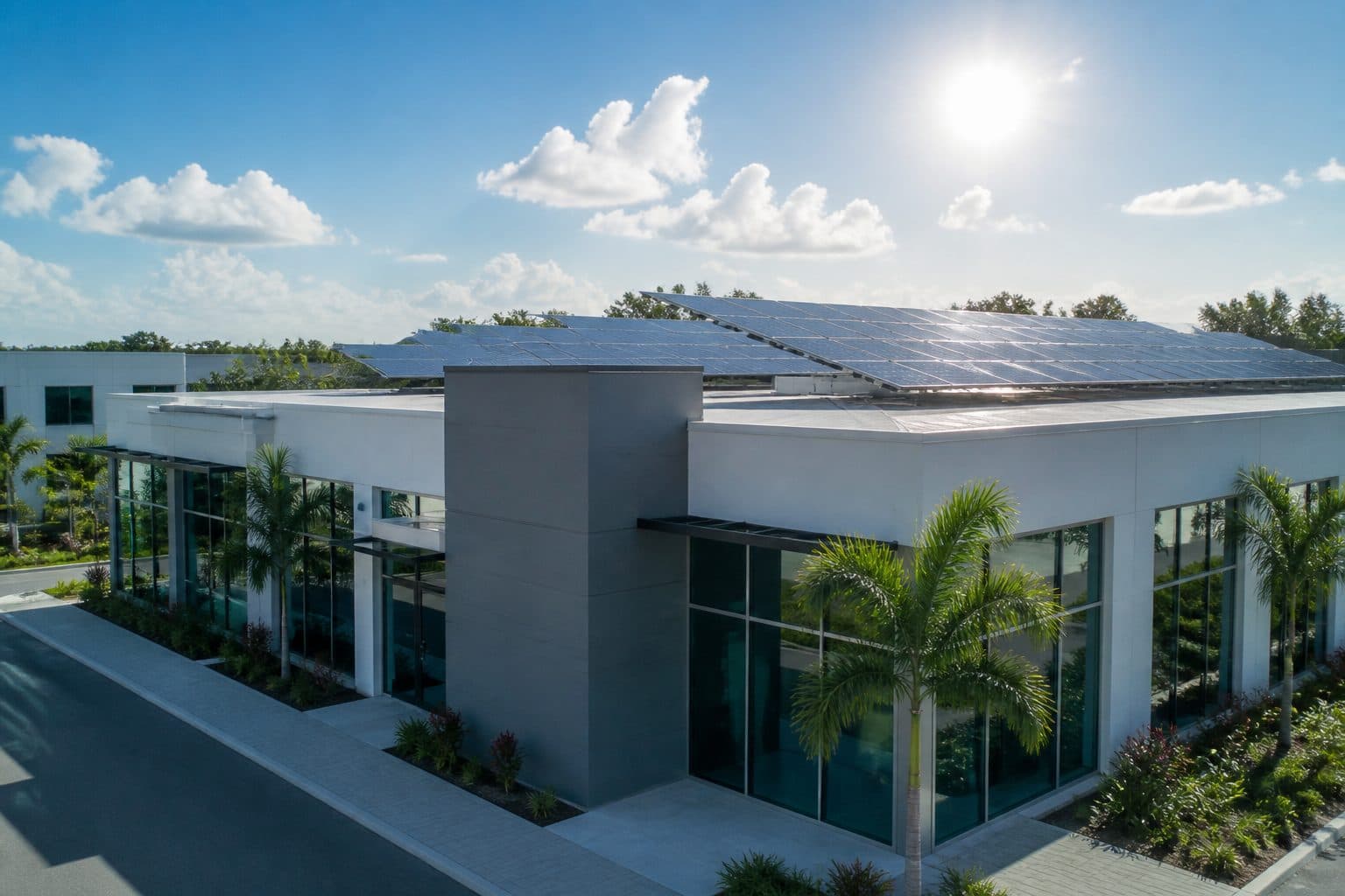Modern commercial building with rooftop solar panels under bright Florida sunlight